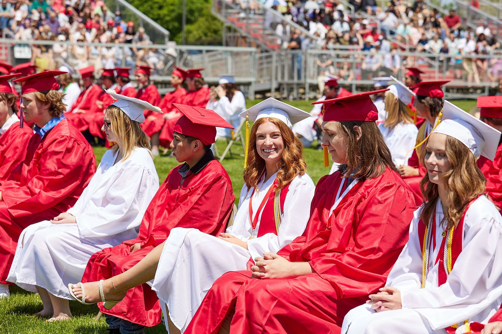 Hall High School senior Jennifer Casford smiles during the graduation ceremony on Sunday, May 21, 2023, outdoors at the high school.