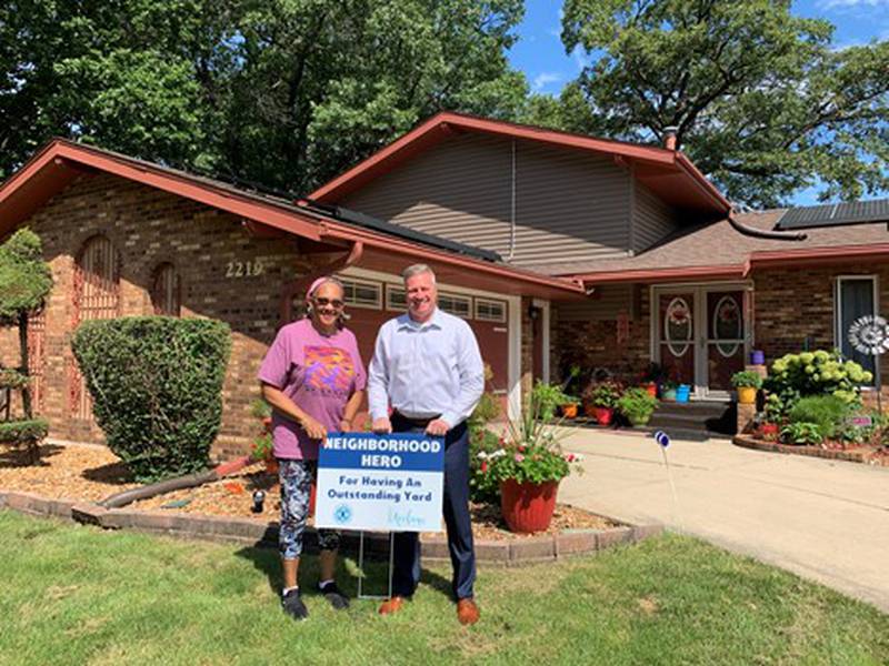 Neighborhood Hero Award winner Judith Miller at her home at 2219 Fiesta Drive with City Councilman Joe Clement