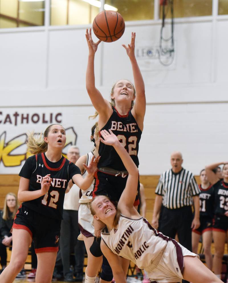 With teammate Lindsay Harzich backing her up, Benet AcademyÕs Bridget Rifenburg grabs a rebound as Montini's Victoria Matulevicius falls to the floor during the semifinal of the Montini girls basketball tournament Thursday December 28, 2023 in Lombard.