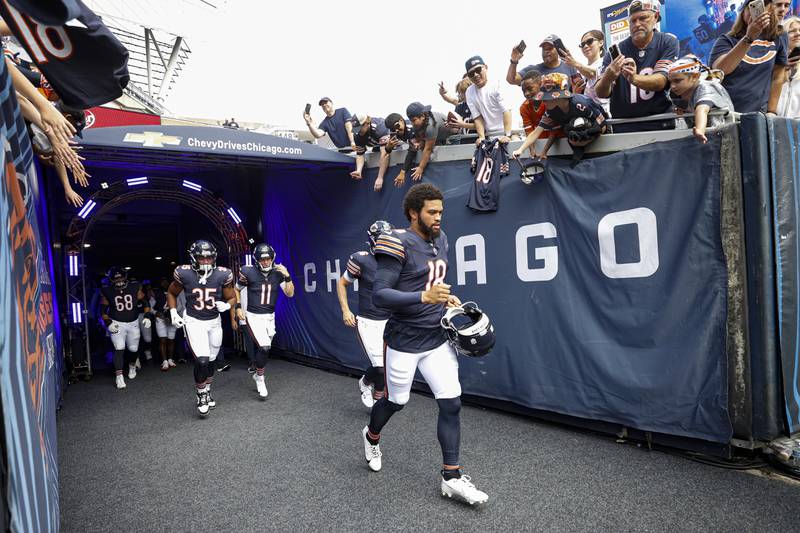 Chicago Bears quarterback Caleb Williams (18) arrives on the field prior to an NFL preseason football game against the Cincinnati Bengals, Saturday, Aug. 17, 2024, in Chicago. (AP Photo/Kamil Krzaczynski)