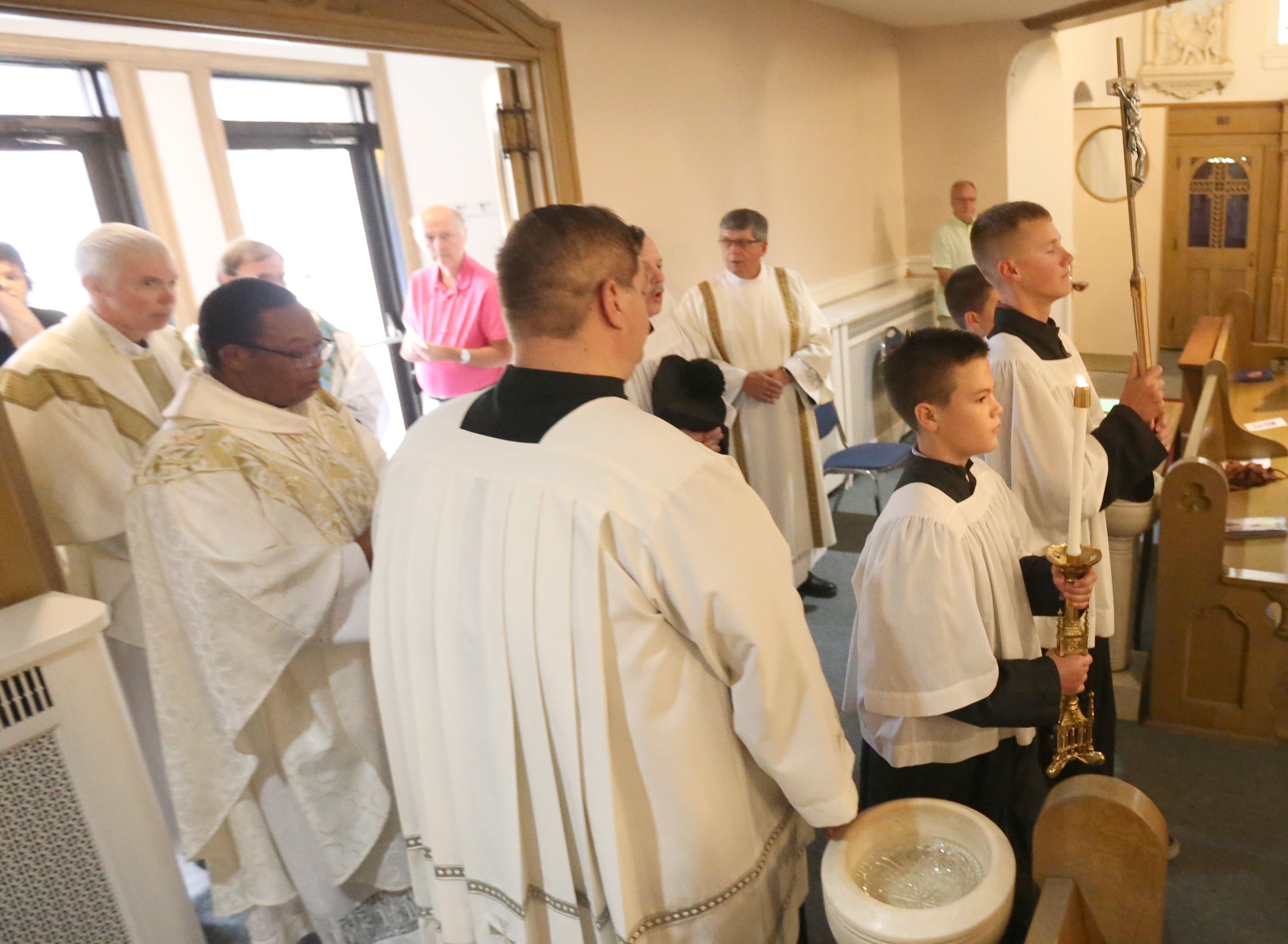 Servers and Clergy enter St. Mary's Church during the final Mass on Thursday, Aug. 15, 2024 in Peru. The church was founded in 1867.