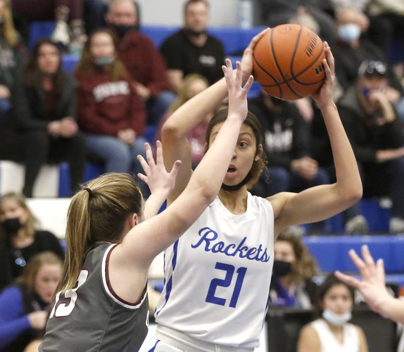 Burlington Central's Taylor Charles looks to pass the ball while being defended by Prairie Ridge's Abigail Kay during Fox Valley Conference girls basketball game Monday evening, Jan. 31 2022, between Prairie Ridge and Burlington Central at Burlington Central High School.