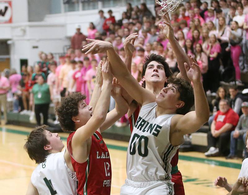 St. Bede's Halden Hueneburg and Nathan Husser and L-P's Michael Hartman and Josh Senica look to grab a rebound on Wednesday, Feb. 14, 2024 at St. Bede Academy.