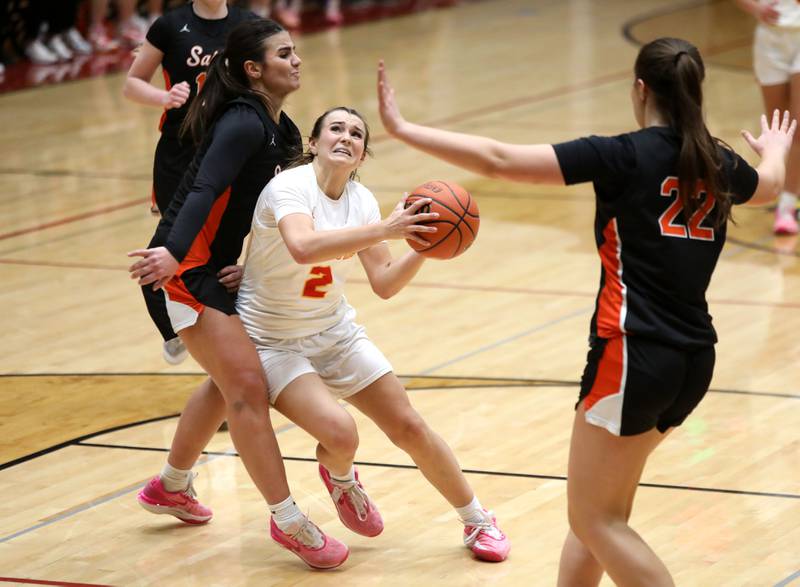 Batavia’s Brooke Carlson gets past St. Charles East’s Lexi Di Orio during a Class 4A Batavia Sectional semifinal game on Tuesday, Feb. 20, 2024.