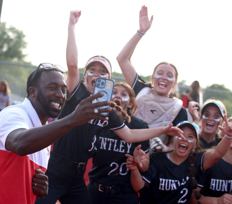Huntley’s Red Raiders celebrate a win over Barrington in sectional final softball action at Barrington Friday.