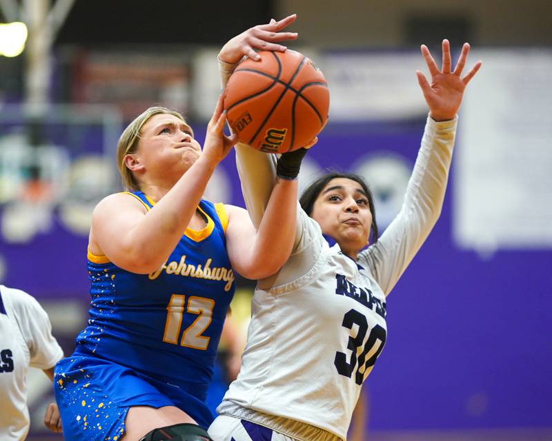 Plano's Aleksa Martinez (30) defends the paint against Johnsburg's Kaylee Fouke (12) during a basketball game at Plano High School on Tuesday, Jan 30, 2024.