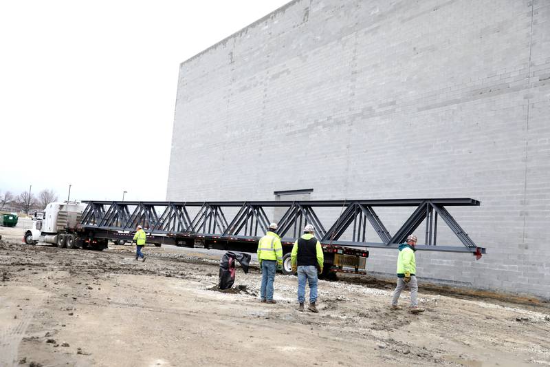 Emagine Entertainment, Inc. executives and project managers facilitated the installation of the trusses in what will be the largest movie theater screen in Illinois, the Super EMX auditorium, at the Emagine Batavia theater on Wednesday, Feb. 15, 2023. The three steel beams are 15,000 pounds each.