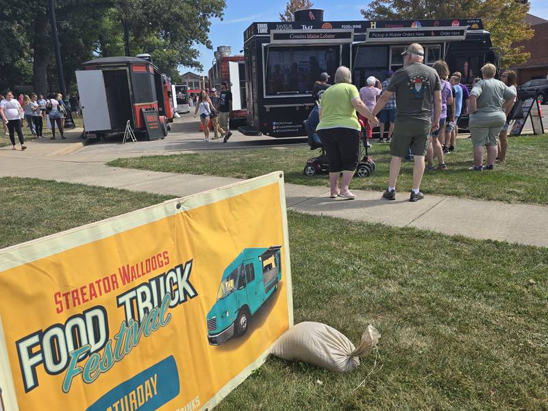 Visitors wait in a line at the Cousins Maine Lobster food truck Saturday, Sept. 14, 2024, during the Fall Food Truck Festival in Streator's City Park.