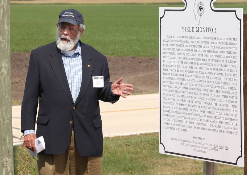 Chuck Stanley, from the Illinois State Historical Society, makes some remarks Tuesday, Sept. 10, 2024, during the dedication, hosted by the DeKalb Area Agricultural Heritage Association, for the new historical marker at the farm of Steve Faivre in DeKalb. The marker celebrates the creation yield monitor, an important innovation in farming.