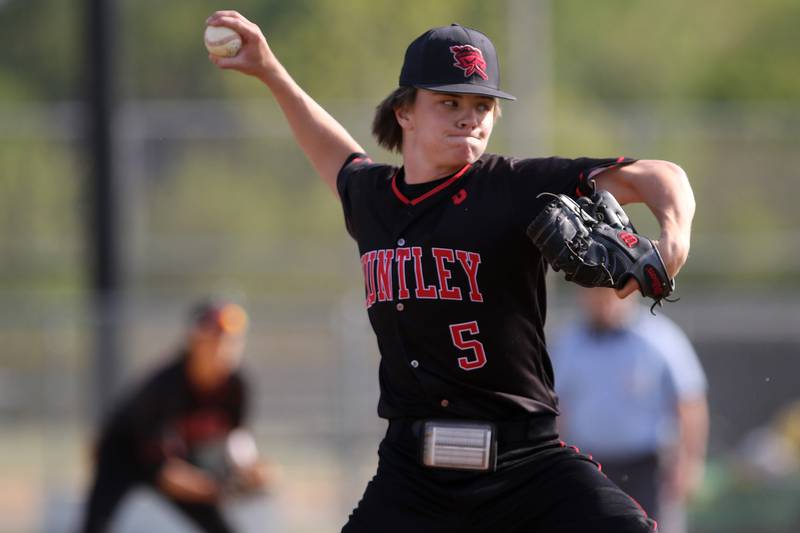 Huntley pitcher Andrew Ressler hurls the ball to a McHenry batter during their baseball game at Petersen Park on Friday, May 14, 2021 in McHenry.