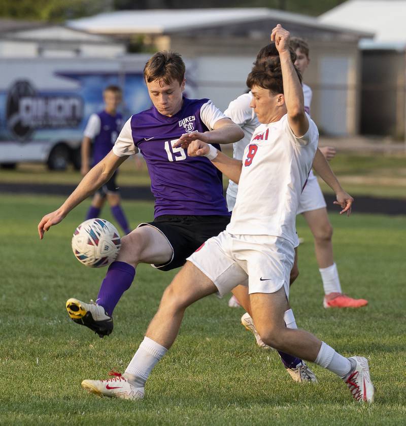 Dixon’s Logan Greet and Oregon’s Michael Jacinto play the ball Wednesday, Sept. 11, 2024, at EC Bowers field in Dixon.