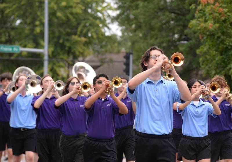 Members of the Downers Grove North marching band perform during the Downers Grove Fourth of July Parade on Thursday, July 4, 2024.