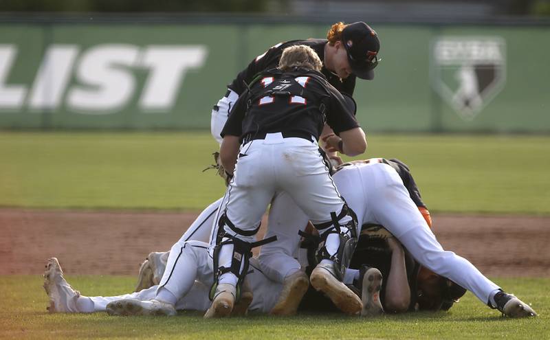 Crystal Lake Central's Connor Gibour is mugged by his teammates after they won the Class 3A Grayslake Central sectional championship baseball game against Deerfield on Friday, May 31, 2024, at the Grayslake Central High School.