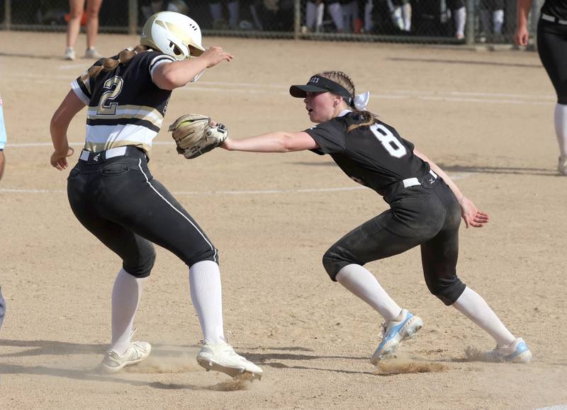 Sycamore's Brighton Snodgrass tries to avoid the tag of Prairie Ridge's Adysen Kiddy during their Class 3A sectional final Friday, May 31, 2024, at Sycamore High School.