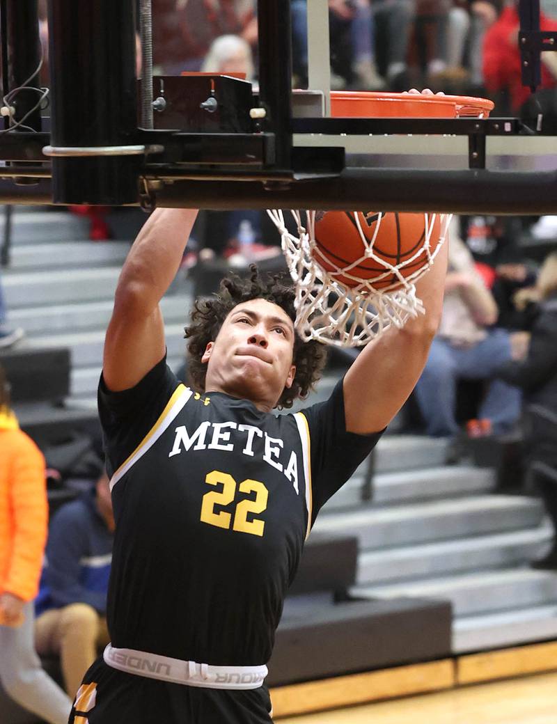 Metea Valley's Will Ashford gets ahead the DeKalb defense for a dunk during their game Friday, Jan. 19, 2024, at DeKalb High School.