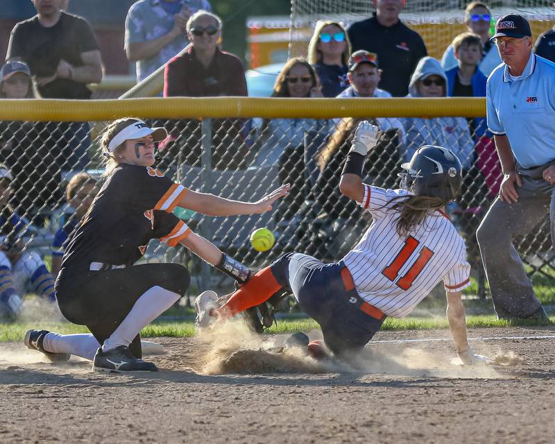 Oswego's Kaylee LaChappell (11) slides in safe at third during Class 4A Plainfield North Sectional semifinal softball game between Wheaton-Warrenville South at Oswego. May 29th, 2024.