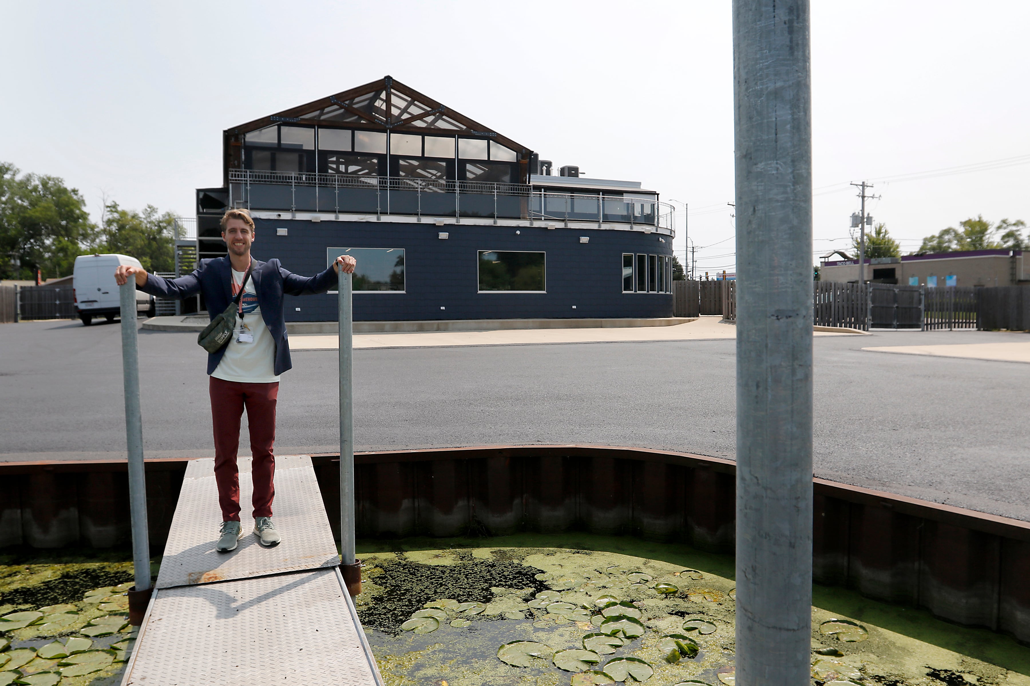 Smokehouse General Manager Zach Edgerton stands on one of the dispensary docks that allow customers on the Fox River and Chain O' Lakes can boat right up to the dispensary.