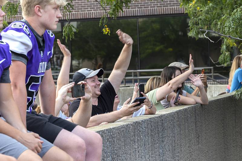 Fans wave to actor Dennis Quaid on Thursday, Aug. 22, 2024, outside of The Dixon.