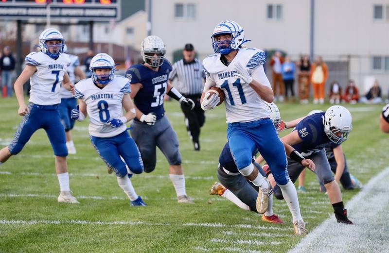 Princeton's Noah LaPorte tip toes the sidelines on a punt return Saturday at Monmouth.