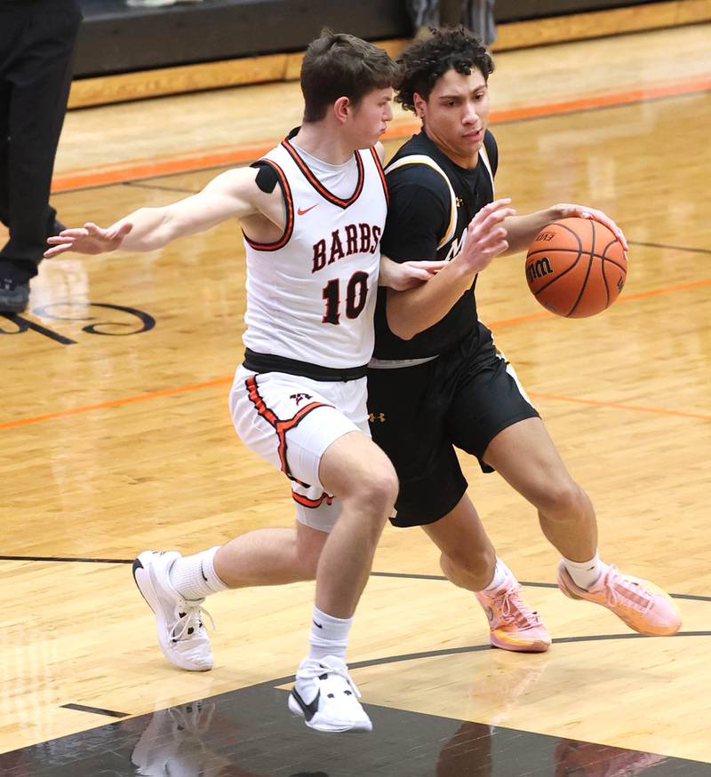 DeKalb’s Eric Rosenow guards Metea Valley's Will Ashford during their game Friday, Jan. 19, 2024, at DeKalb High School.