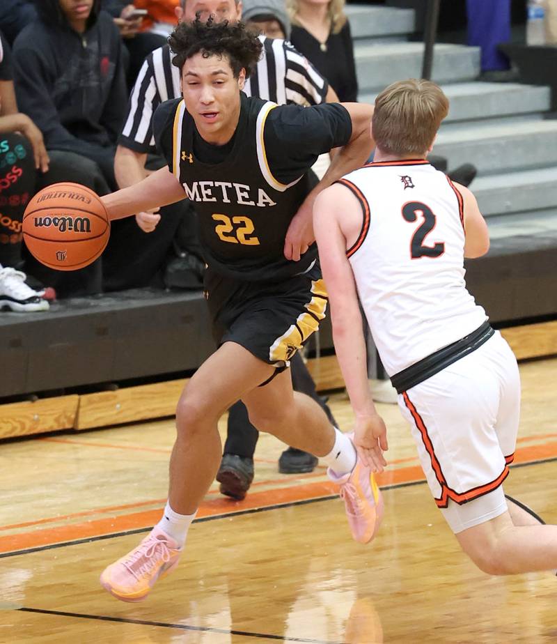 Metea Valley's Will Ashford tries to go around DeKalb’s Sean Reynolds during their game Friday, Jan. 19, 2024, at DeKalb High School.