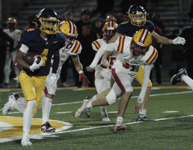 Sterling's Quincy Maas takes off upfield against. Rock Island. Action took place on Friday, October  18th, 2024 in Sterling.