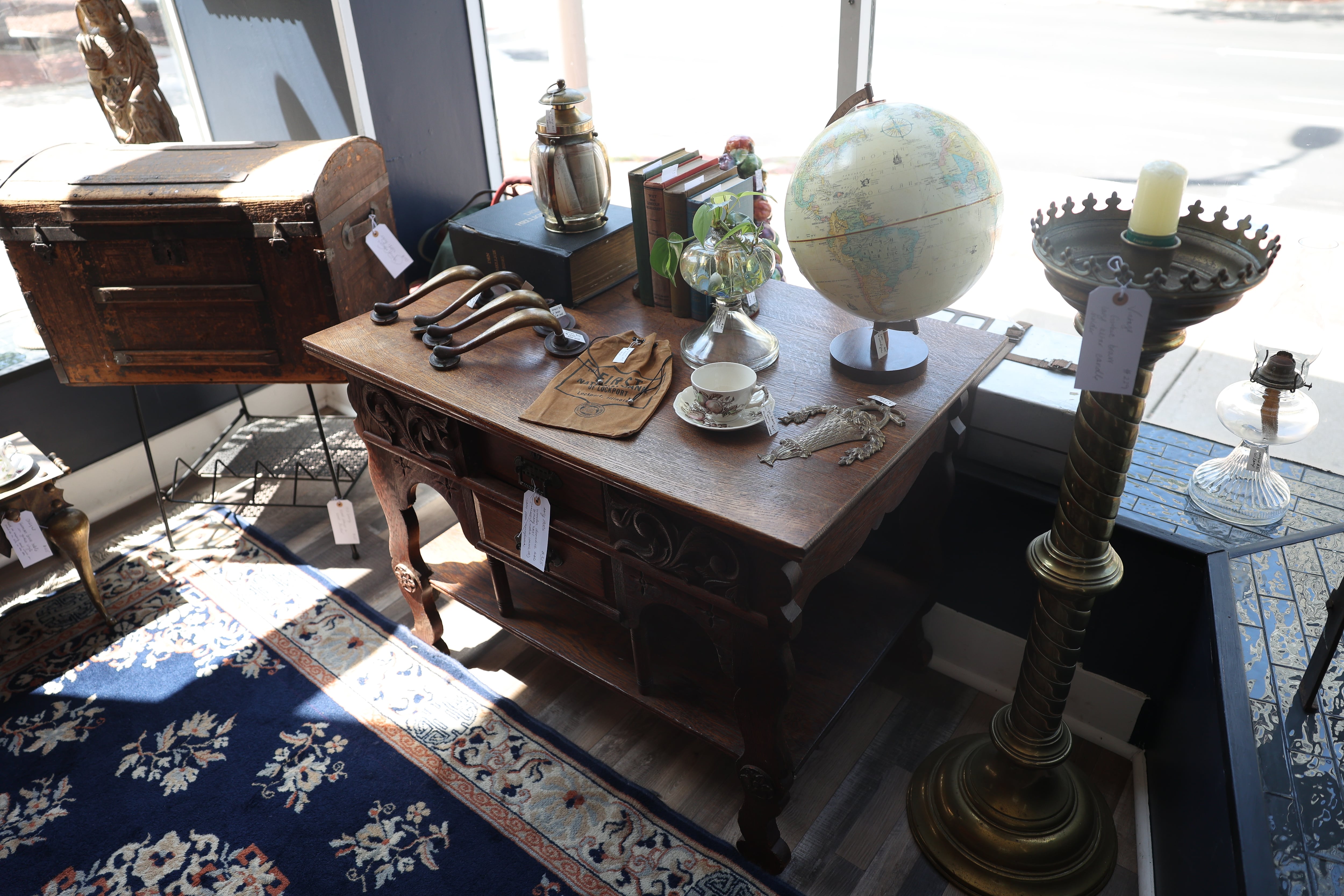 A variety of antique items sit on display at Black Cat Curiosities in downtown Joliet on Wednesday, July 31, 2024.