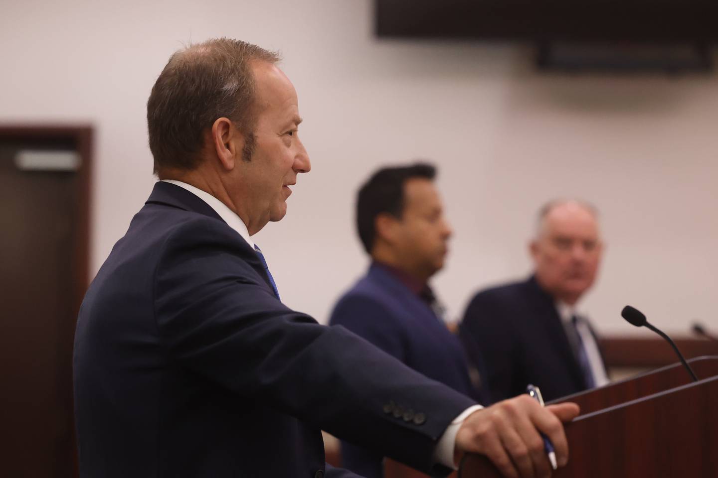 Kendall County Assistant State’s Attorney Mark Shlifka, left, speaks to the judge at the hearing for retired Joliet police sergeant Javier Esqueda at the Kendall County Courthouse in Yorkville. Esqueda is charged with official misconduct for accessing and leaking the police squad video of the arrest of Eric Lurry, 37, who died following his arrest on drug charges in January 2020.