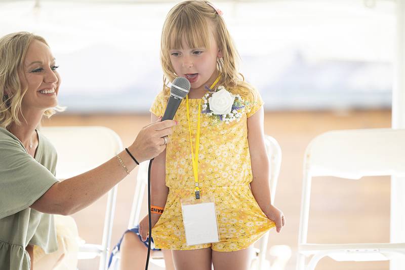 Heather Faivre lets Adalynn Bennett, 5, show off her talent for the Little Miss contest Thursday, June 13, 2024, at Polo’s Town and Country Days.