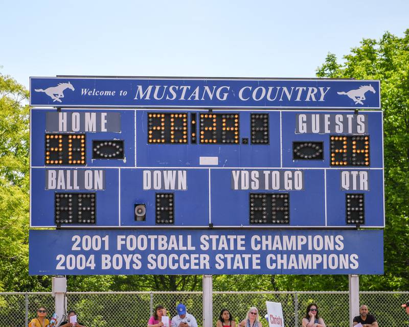 Downers Grove South High School uses the football scoreboard during the graduation ceremony honoring the class of 2024 held on Sunday May 19, 2024.