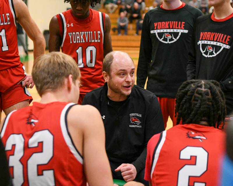 Yorkville's head coach John Holakovsky talks to the team between quarters on Tuesday Dec. 26, 2023, during the Jack Tosh tournament held at York High School in Elmhurst.