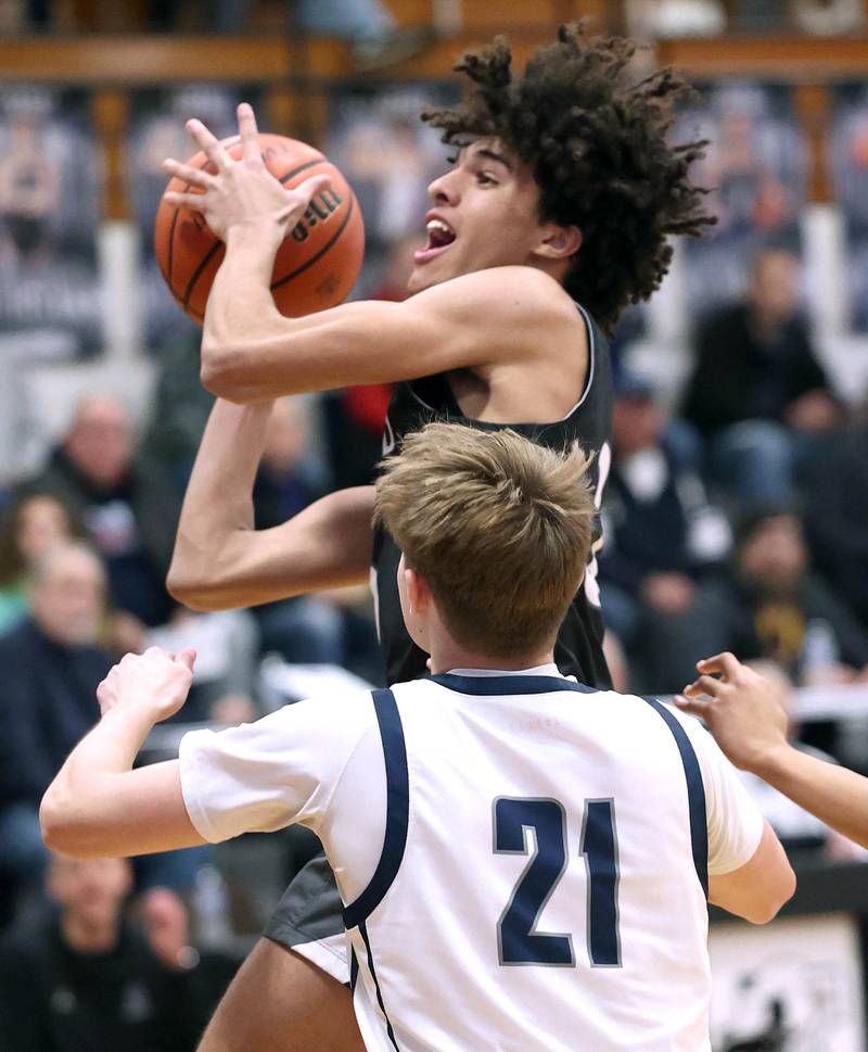 Kaneland's Evan Frieders goes to the basket against Belvidere North's Adam Brown Wednesday, Feb. 28, 2024, during their Class 3A sectional semifinal game at Kaneland High School in Maple Park.