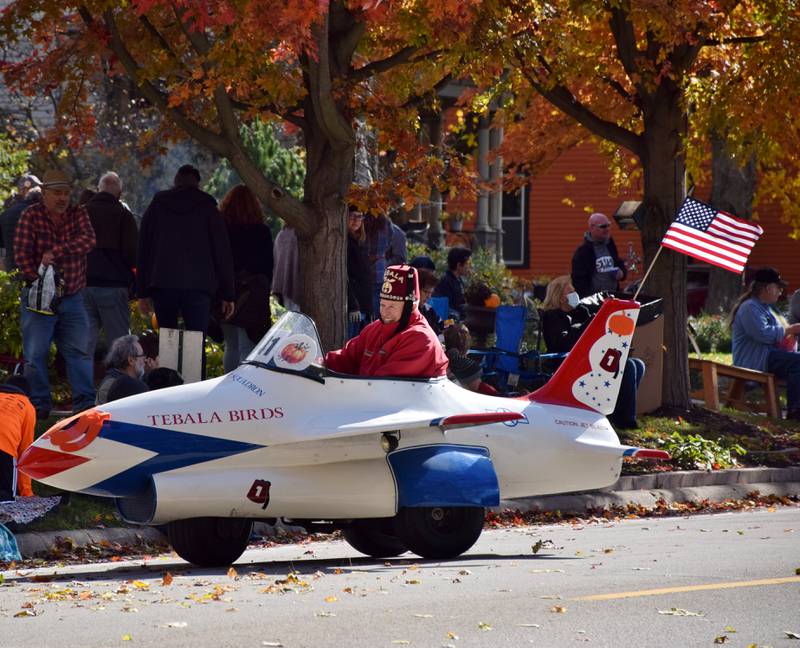 A Tebala Shriner drives a miniature replica of a U.S. Air Force Thunderbird during the Sycamore Pumpkin Festival, held Sunday, Oct. 31, 2021.