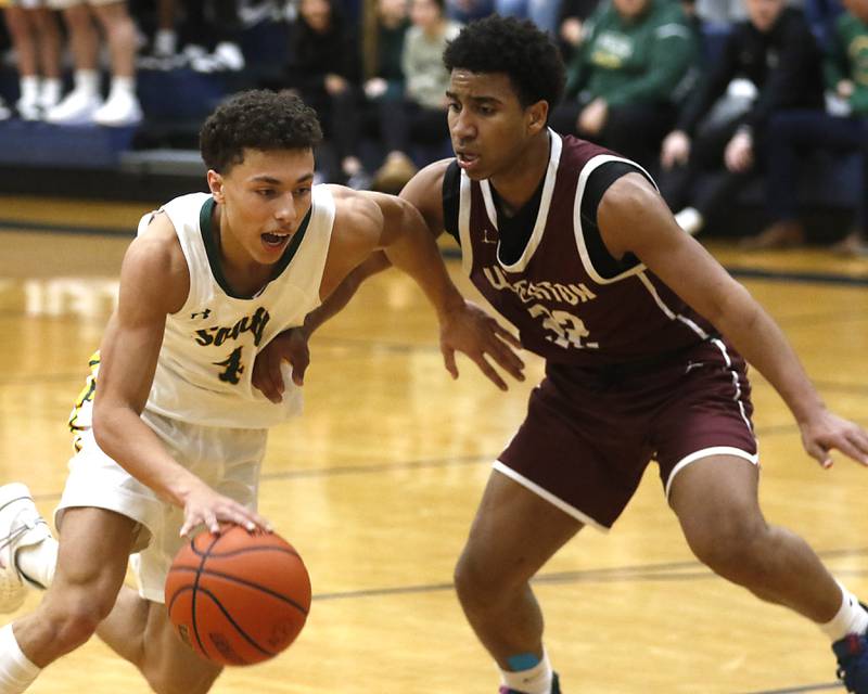 Crystal Lake South's AJ Demirov drives the lane against Wheaton Academy's Wandy Munoz during the IHSA Class 3A Cary-Grove Boys Basketball Regional Championship game on Friday, Feb. 23, 2024 at Cary-Grove High School.