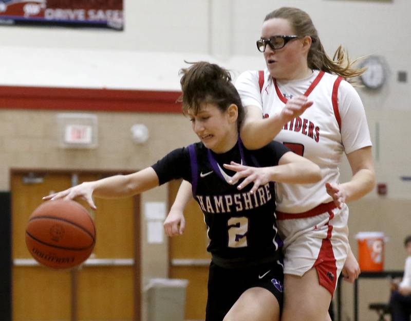 Hampshire's Alex Montez tries to control the ball as he is guarded by Huntley's Mallory Winters during a Fox Valley Conference girls basketball game Monday, Jan. 30, 2023, at Huntley High School.