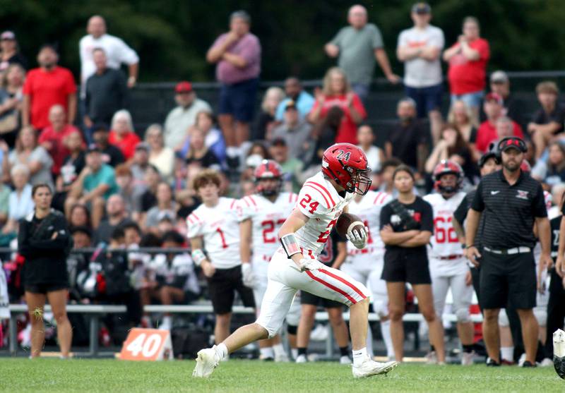 Huntley’s Gavin Havens finds running room in varsity football on Friday, Aug. 30, 2024, at Metcalf Field on the campus of Crystal Lake Central High School in Crystal Lake.