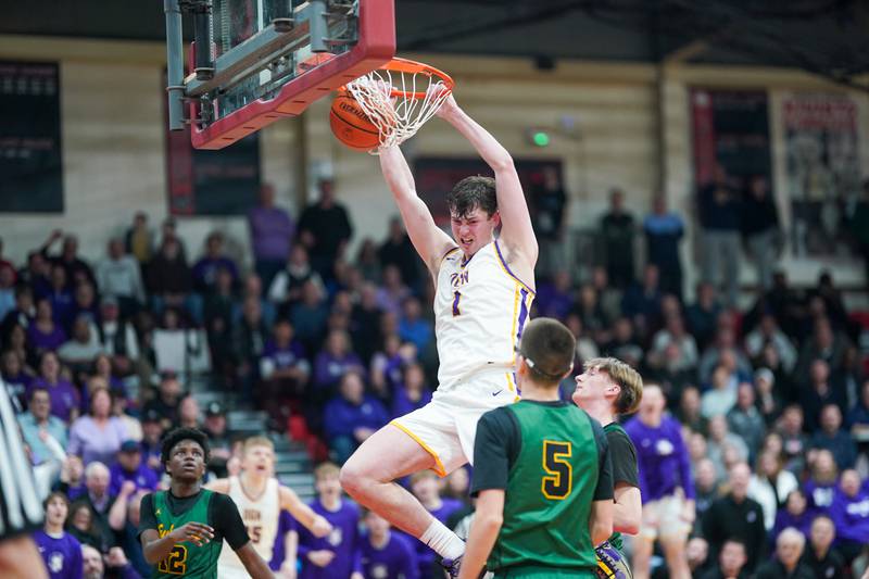 Downers Grove North's Jake Riemer (1) dunks the ball off of a back door cut against Waubonsie Valley during a Class 4A East Aurora sectional semifinal basketball game at East Aurora High School on Wednesday, Feb 28, 2024.