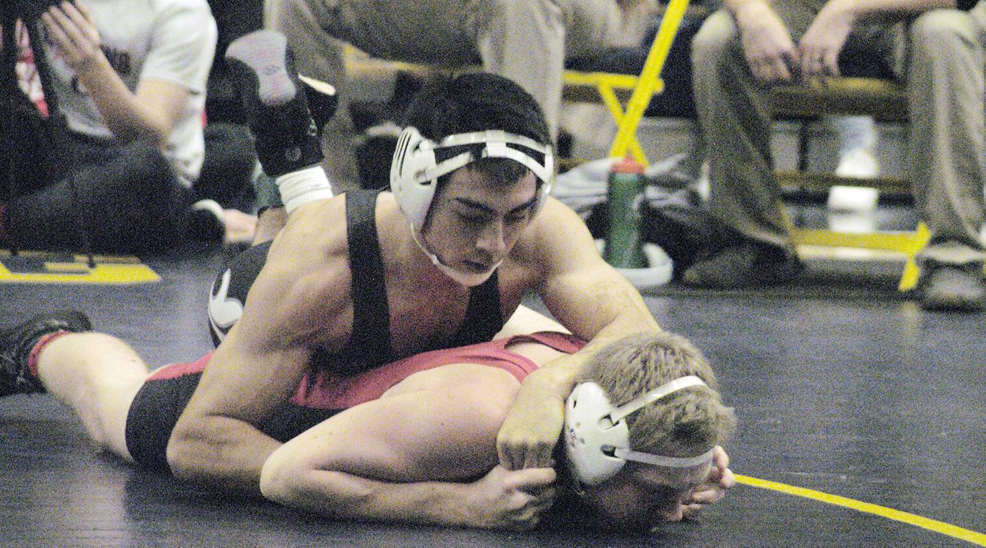 Dixon's Cade Hey (top) battles Clinton's Brady Jennings (bottom) in the 150-pound championship match. The action took place on Saturday, Dec. 2, 2023, at Sterling High School's 45th Annual Carson DeJarnatt Tournament.