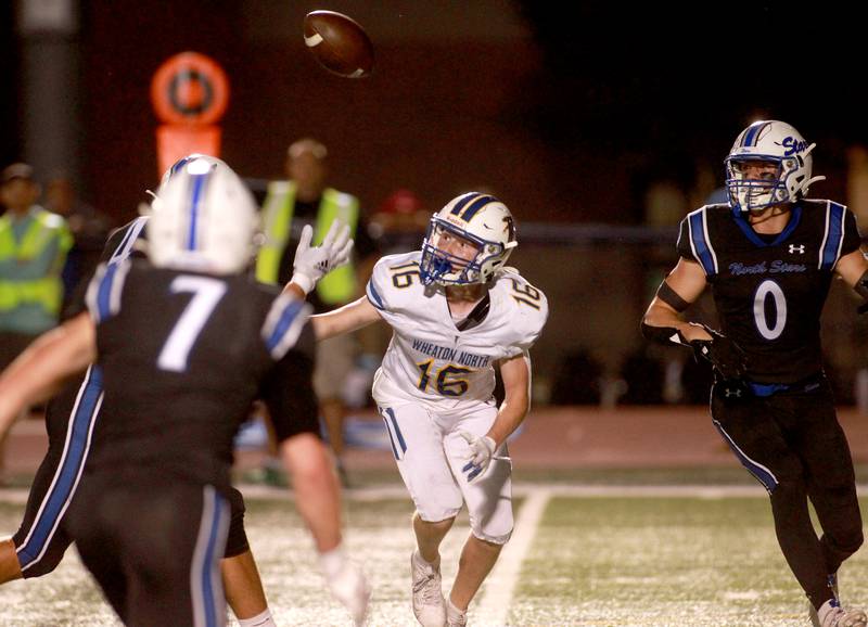 Wheaton North’s Tyler Kading fumbles the ball during a game Friday, Sept. 13, 2024 at St. Charles North.