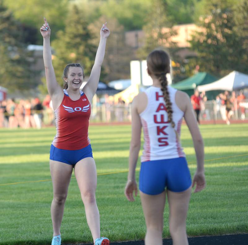 Oregon's Lexi Ebert gets ready to hug Daleanah Koertner after the Hawks finished second in the 4x200 relay at the 1A Oregon Sectional on Friday. May 10, 2024. The Hawks took second in the race behind Forreston-Polo to qualify for the state meet in Charleston.