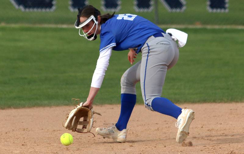 Burlington Central’s Anna Sanders fields a grounder in varsity softball at Cary Monday.