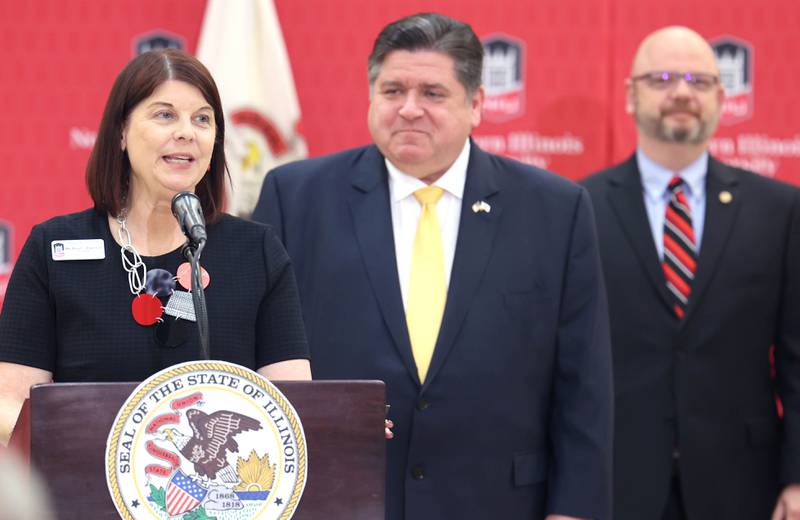 Northern Illinois University President Lisa Freeman speaks as Gov. JB Pritzker looks on during a news conference Tuesday, April, 4, 2023, in the Barsema Alumni and Visitors Center at Northern Illinois University in DeKalb. Pritzker along with a group of llinois lawmakers, DeKalb city officials and representatives from NIU were on hand to promote the importance of funding higher education in Illinois.