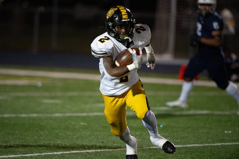 Joliet West's Gerard Bush runs the ball during a game against Plainfield South  Friday Oct. 4, 2024 at Plainfield South High School