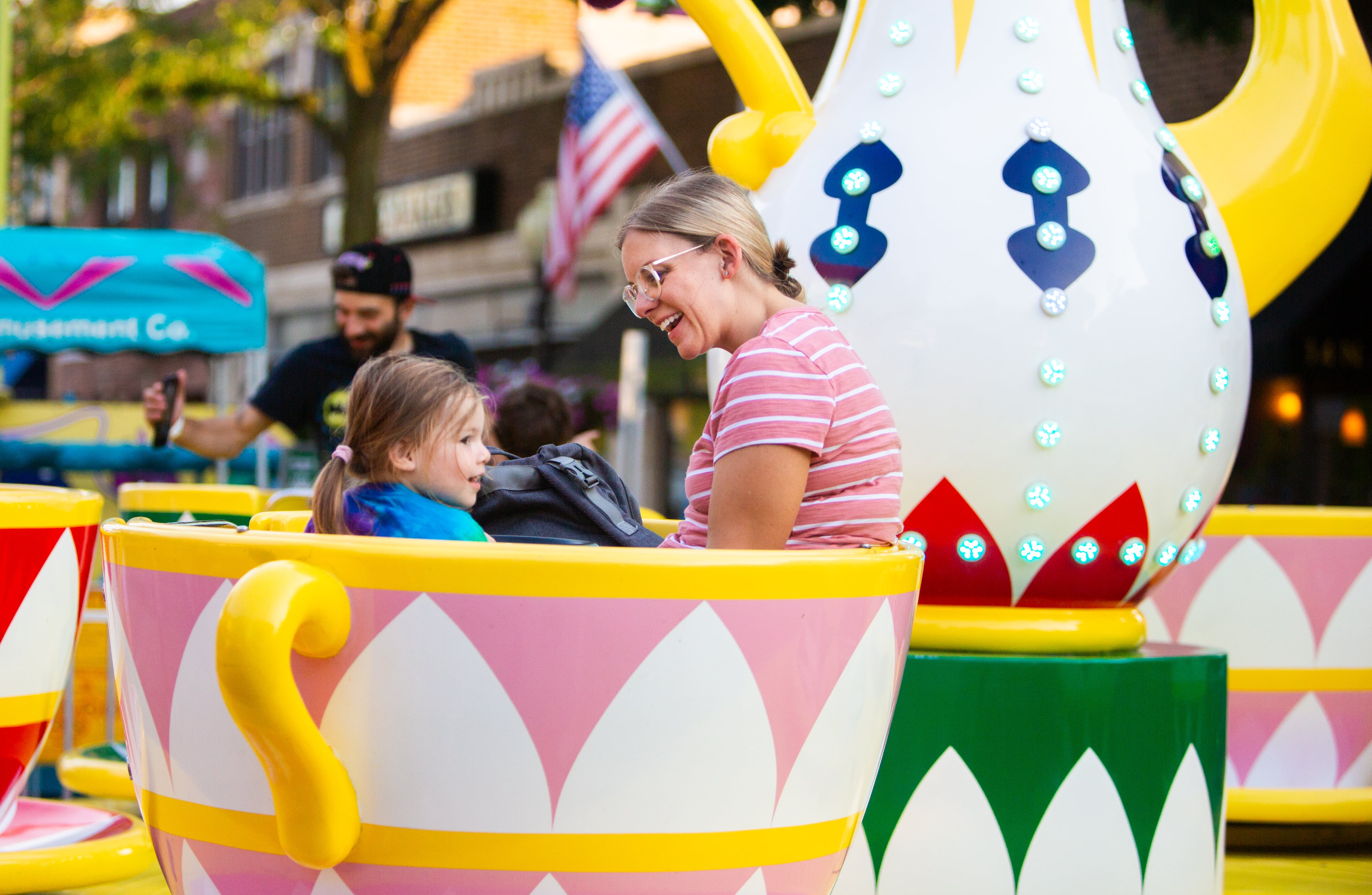 Heather Anfuso and her daughter Mila, 2, ride the teacups at The Taste of Westmont on Saturday, July 13.