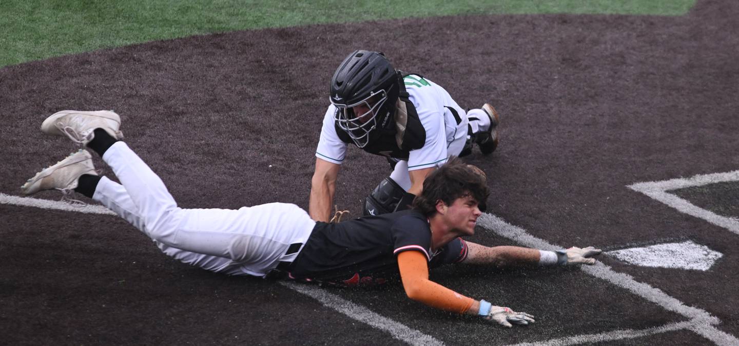 York catcher Noah Jones tags out Edwardsville's Lucas Krebs, who was trying to score on what would have been an inside-the park home run during the bottom of the third inning of the Class 4A state baseball third-place game at Duly Health and Care Field on Saturday, June 8, 2024 in Joliet.