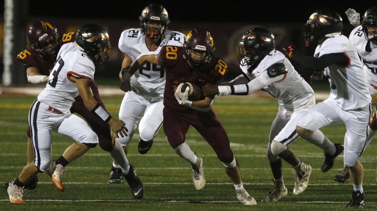 Richmond-Burton's Luke Johnson runs the ball though the Sandwich defense during a Kishwaukee River Conference football game on Friday, Oct. 4, 2024, at Richmond-Burton High School.