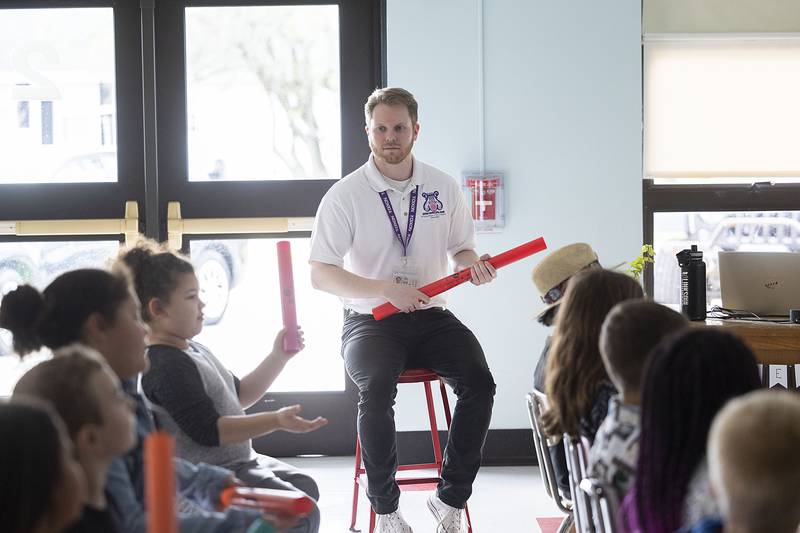 Jefferson School music teacher Nolan Lewis leads his class Friday, April 21, 2023. Lewis requested money from the Dixon Schools Foundation go to purchase the plastic instruments. Last year the foundation purchased ukeleles for the music program.