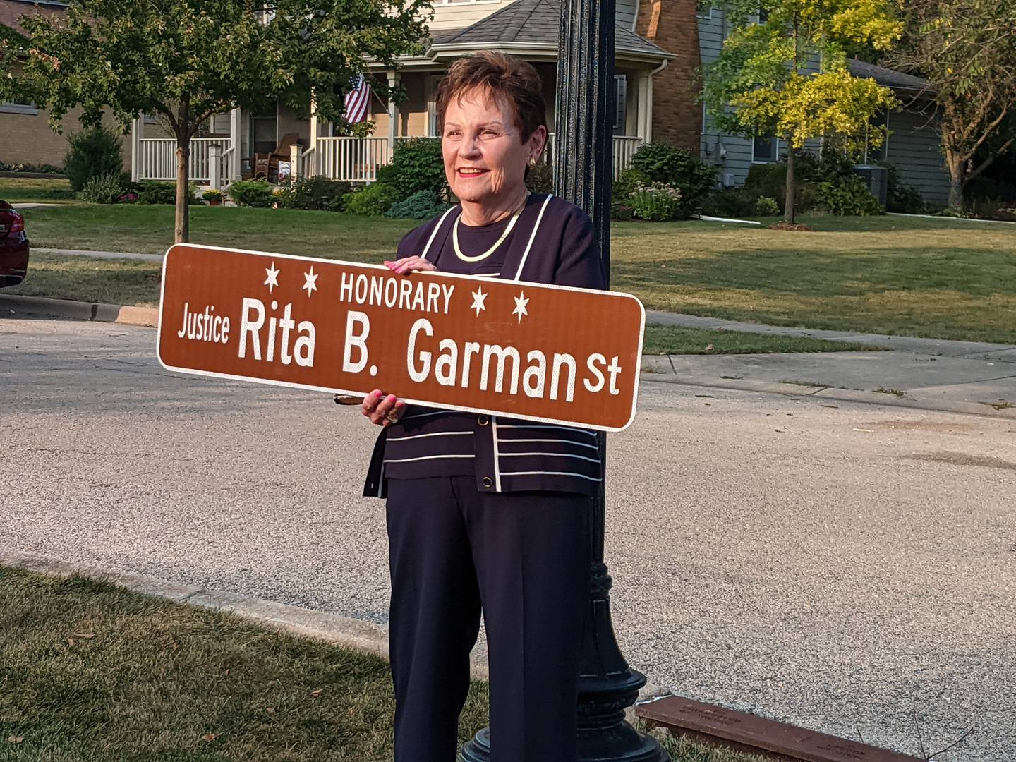 During a Sept. 9 ceremony, Garfield Street in Oswego was dedicated to retired Illinois Supreme Court Justice Rita Garman. Garman, who was the second woman to serve on the Illinois Supreme Court, grew up on Garfield Street.