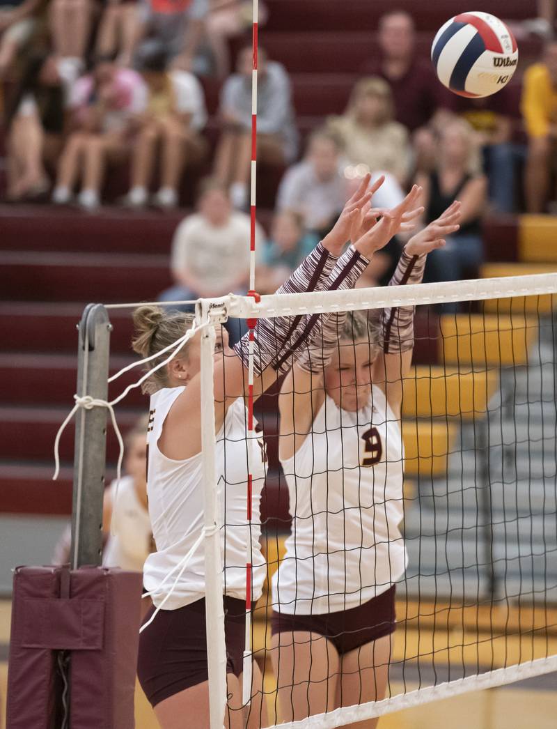 Richmond-Burton's Zoe Freund, left, and Reagan Wisniewski block a shot during their game against Johnsburg on Monday, August 26, 2024 at Richmond-Burton High School in Richmond.