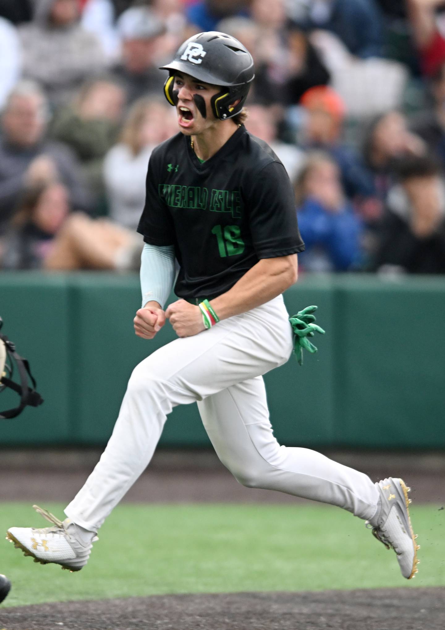 Providence’s Mike Sanfratello celebrates as he scores the game’s first run during the top of the second inning against Conant in the Class 4A state baseball championship game at Duly Health and Care Field on Saturday, June 8, 2024 in Joliet.